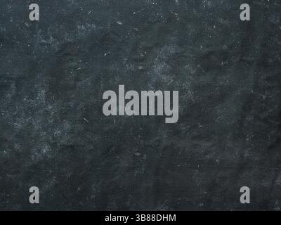 Dark mottled rustic background. Black blue canvas backdrop for design. Natural linen colored black blue dirty canvas fabric background or texture Stock Photo