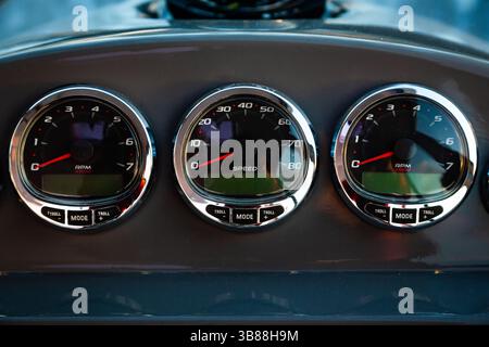 Motor yacht control panel. Gauges, speedometers and control buttons. Stock Photo