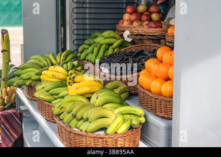 Colorful assortment of tropical fruits and vegetables in traditional market stall Stock Photo