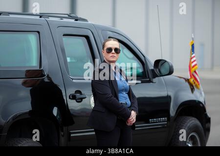 June 1, 2024, Seattle, Washington, U.S: A special agent watches stands guard as Vice President Kamala Harrisâ€™ motorcade departs Boeing Field in Seattle on Saturday, June 1, 2024. Harris is making a brief stop in the city to attend fundraising events for the Biden-Harris 2024 reelection campaign. (Credit Image: © Paul Christian Gordon/ZUMA Press Wire) Stock Photo