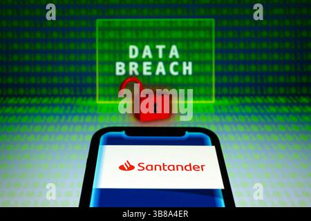 May 31, 2024, Asuncion, Paraguay: Santander logo is displayed on a smartphone in front of the words ''data breach'', visual representation of open padlock and binary code digits. (Credit Image: © Andre M. Chang/ZUMA Press Wire) Stock Photo