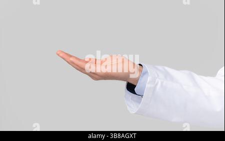 Male doctor's hand ponting or holding virtual object on open palm Stock Photo