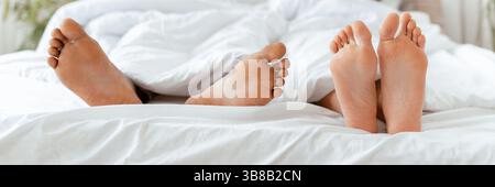 Relax on weekend, romance together and lazy couple at free time in morning Stock Photo