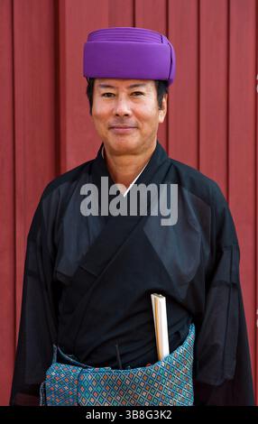 Okinawan man in traditional costume Ryukyu Mura, historical village ...
