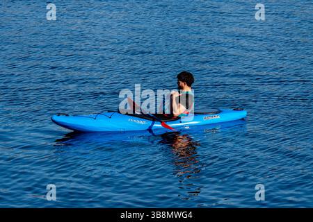Young man kayaking on the waters of Bristol - UK Stock Photo