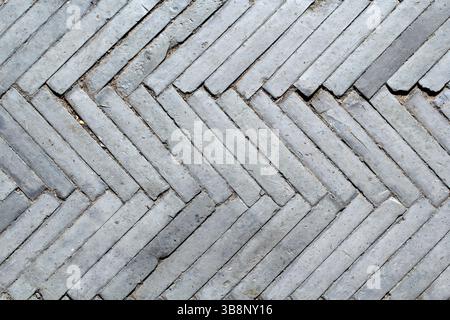 Bricks tiles in a Herringbone pattern textured abstract background Stock Photo