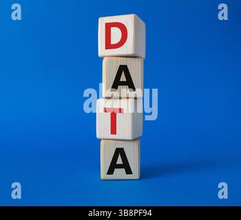Data symbol. Concept word Data on wooden cubes. Beautiful blue background. Business and Data concept. Copy space. Stock Photo