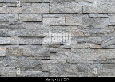 Texture of gray brick slate stone wall surface Stock Photo