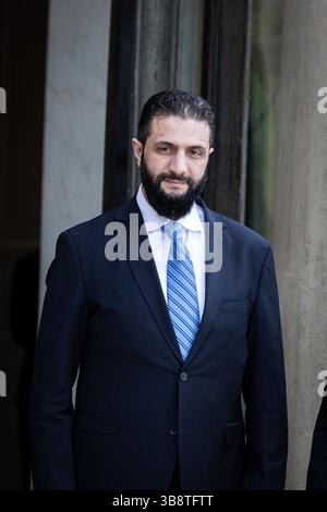 Paris, France. 07th May, 2025. Ahmed al-Sharaa, Syria's interim President, seen at the entrance of the Elysee Presidential Palace during the meeting. The French President met with the Ahmed al-Sharaa, Syria's Interim President at the Elysee Presidential Palace, in Paris. This was the first visit of Ahmed al-Sharaa to a European country as leader of the transitional government, following the fall of the Assad regime in December. Credit: SOPA Images Limited/Alamy Live News Stock Photo
