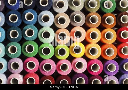 Sewing threads as a multicolored background close up Stock Photo