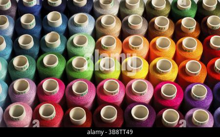 Sewing threads as a multicolored background close up Stock Photo
