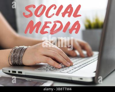 Online shopping soncept. Close-up woman's hands holding credit card and inputting card information using laptop keyboard for online shopping Stock Photo