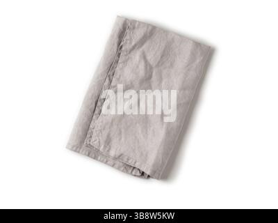 Folded gray linen napkin isolated on white background. Natural light gray linen napkin. Isolated on white with clipping path. Top view or flat lay Stock Photo