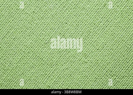 Green fabric texture. Closeup of soft textile surface. Diagonal lines in knitted pattern. Clean background. Simple material for fashion or upholstery. Stock Photo