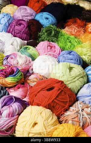 Different color threads on rows in the store Stock Photo