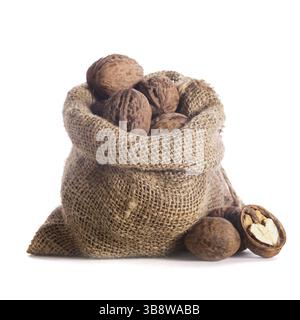 Walnuts in burlap bag isolated on white Stock Photo