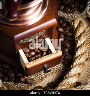 Coffee in grinder and rope still life Stock Photo