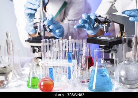 Two scientists in the chemical laboratory are doing experiments Stock Photo