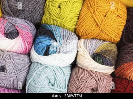 Various colors threads on rows in the store Stock Photo