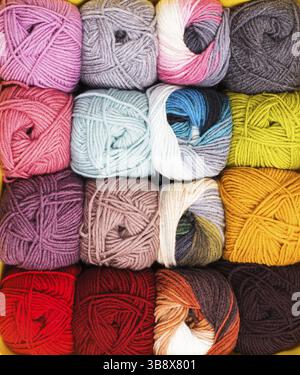 Various colors threads on rows in the store Stock Photo