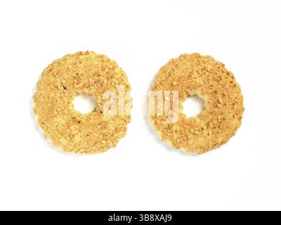 Two shortbread ring cookies with nuts.Sand ring with nuts isolated, white background.Traditional Russian baking - shortcrust ring with peanuts isolate Stock Photo