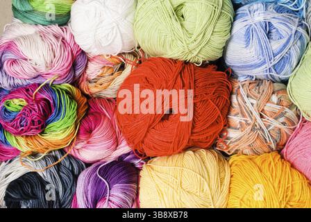 Different color threads on rows in the store Stock Photo