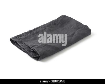 Side view on folded dark black linen napkin isolated on white background. Anthracite grey linen napkin. Isolated on white with clipping path Stock Photo
