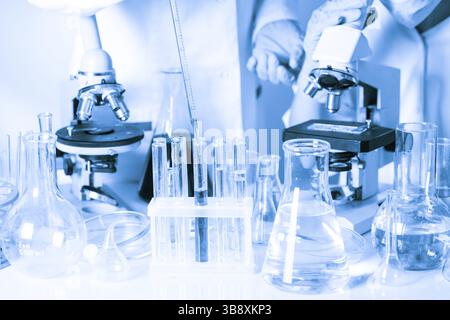 Two scientists in the chemical laboratory are doing experiments Stock Photo