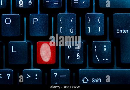 fingerprint on a keyboard key, secure identification concept Stock Photo