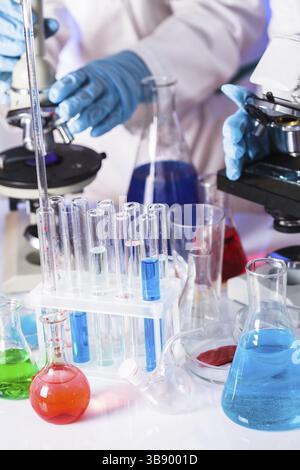 Two scientists in the chemical laboratory are doing experiments Stock Photo