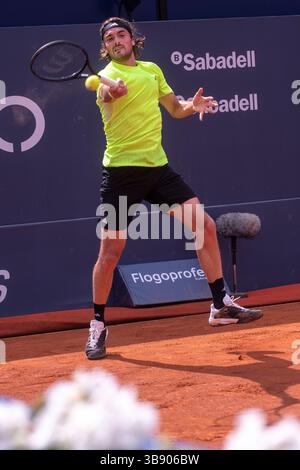Stefanos Tsitsipas from Greece plays against Reilly Opelka from USA during their 1st round match at the ATP 500 Barcelona Open Banc Sabadell - Godó Stock Photo