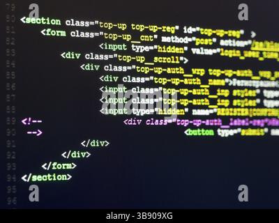Computer Code HTML. Software development. Software source code. Writing programming code on laptop Stock Photo