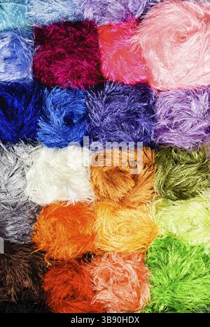 Different color grass threads on rows in the store Stock Photo