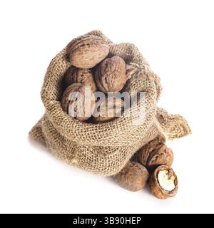 Walnuts in burlap bag isolated on white Stock Photo