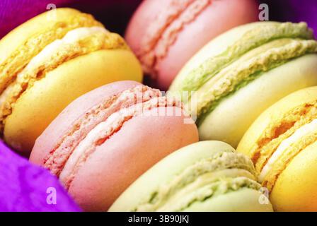 Macaroons in row close up in box Stock Photo