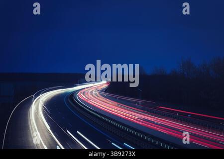 Traffic on the Highway - Travel - Background - Line - Ecology - Long Exposure - Motorway - Night Traffic - Light Trails Stock Photo