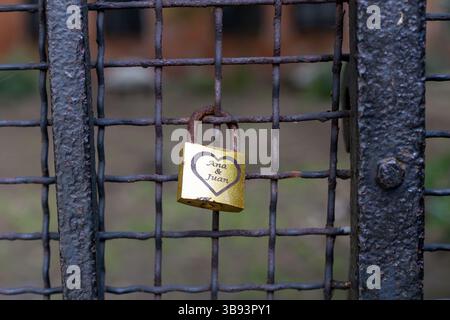Love Padlock on Rusty Metal Grid Stock Photo