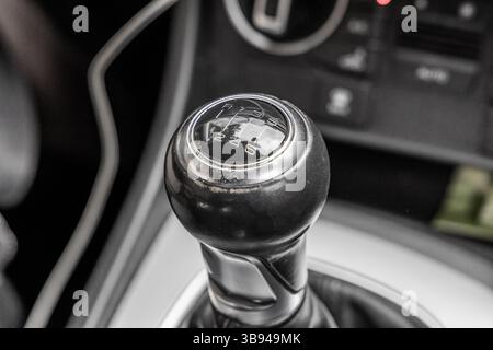 Manual gear stick inside modern car. Manual gearbox lever. Detail on a Manual gear shifter in a car. Six speed gear stick in car. Stock Photo