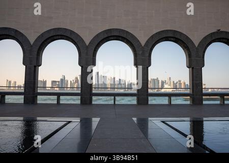 Arches overlooking the city Doha, Qatar. Breathtaking views of the Doha skyline and the Persian Gulf. Stock Photo