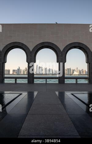 Arches overlooking the city Doha, Qatar. Breathtaking views of the Doha skyline and the Persian Gulf. Stock Photo