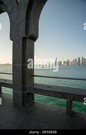 Arches overlooking the city Doha, Qatar. Breathtaking views of the Doha skyline and the Persian Gulf. Stock Photo