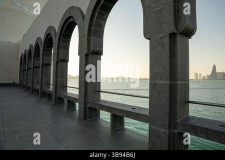 Arches overlooking the city Doha, Qatar. Breathtaking views of the Doha skyline and the Persian Gulf. Stock Photo