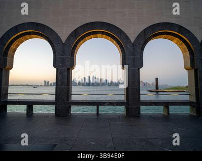 Arches overlooking the city Doha, Qatar. Breathtaking views of the Doha skyline and the Persian Gulf. Stock Photo