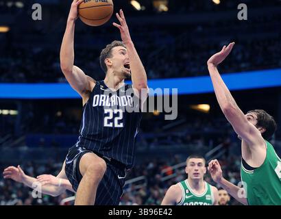 January 23, 2023, Orlando, FL - Florida, USA: Orlando forward Franz Wagner (22) scores during the Boston Celtics at Orlando Magic NBA game at the Amway Center in Orlando on Monday, January 23, 2023. (Credit Image: © Stephen M. Dowell/Orlando Sentinel via ZUMA Press Wire) Stock Photo