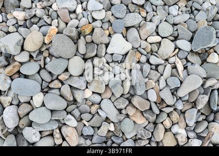 Pebbles on a shingle beach close up for textures and patterns Stock Photo