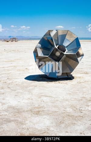 Metal compartmentalized sphere sculpture installation art at the Bombay Beach Biennale, in Bombay Beach, California. Stock Photo