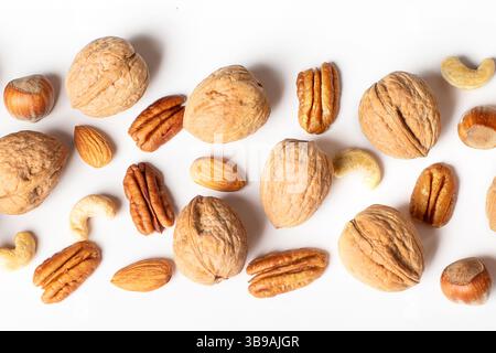 Pattern of nuts on a white background. Top view. Panorama. Stock Photo