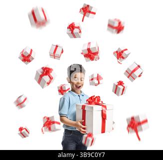 Cute asian boy with many gift boxes flying in the air isolated on white background Stock Photo