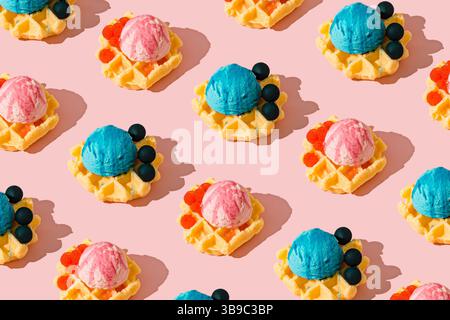 Seamless waffle pattern with pink and blue ice cream scoops and raspberries or blueberries on pastel pink background. Sweet and playful dessert theme. Stock Photo