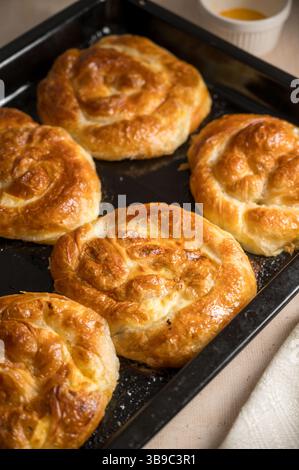 Homemade cottage cheese pies on baking tray Stock Photo